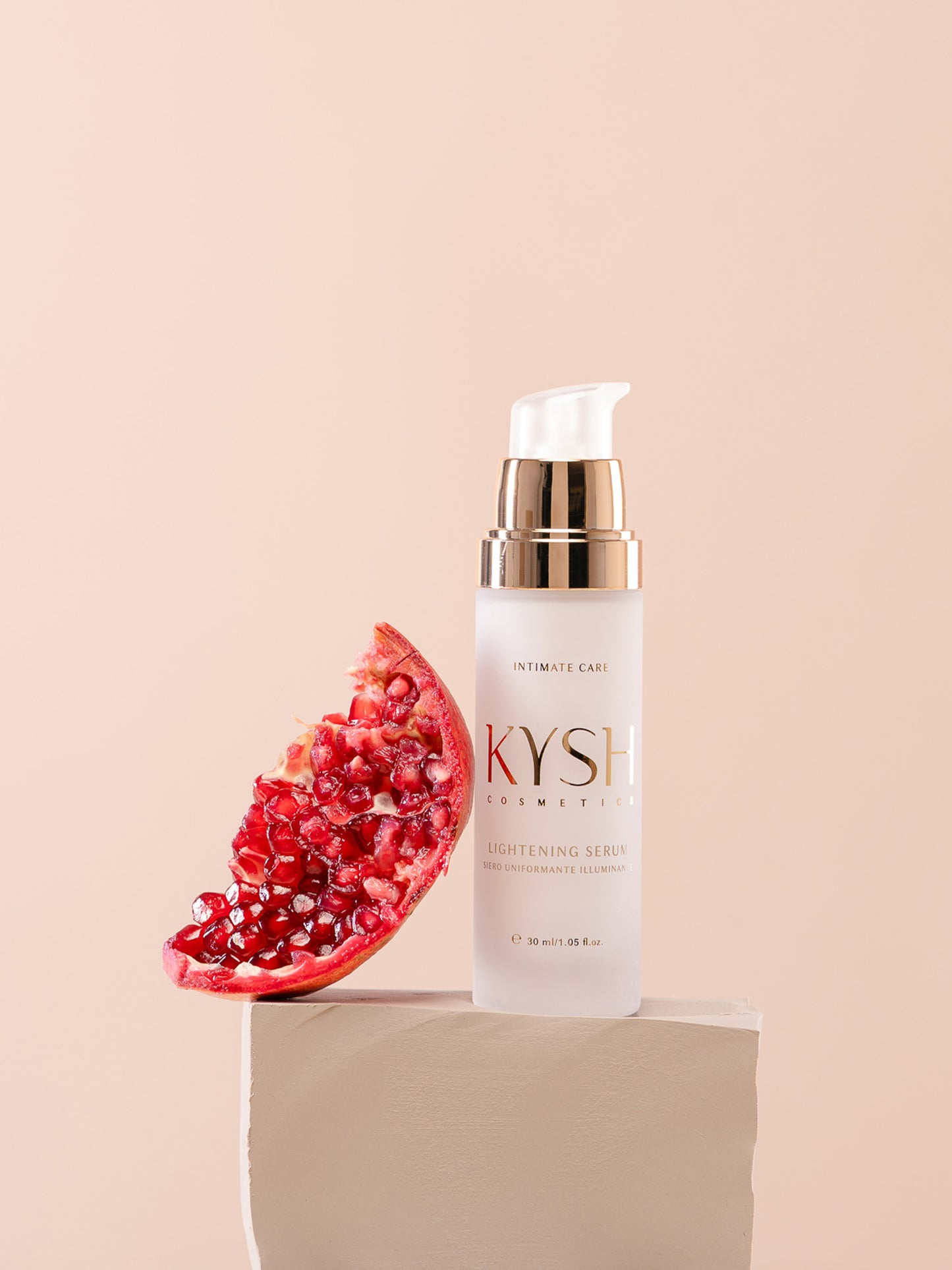 KYSH lightening serum bottle with a pomegranate on a beige background