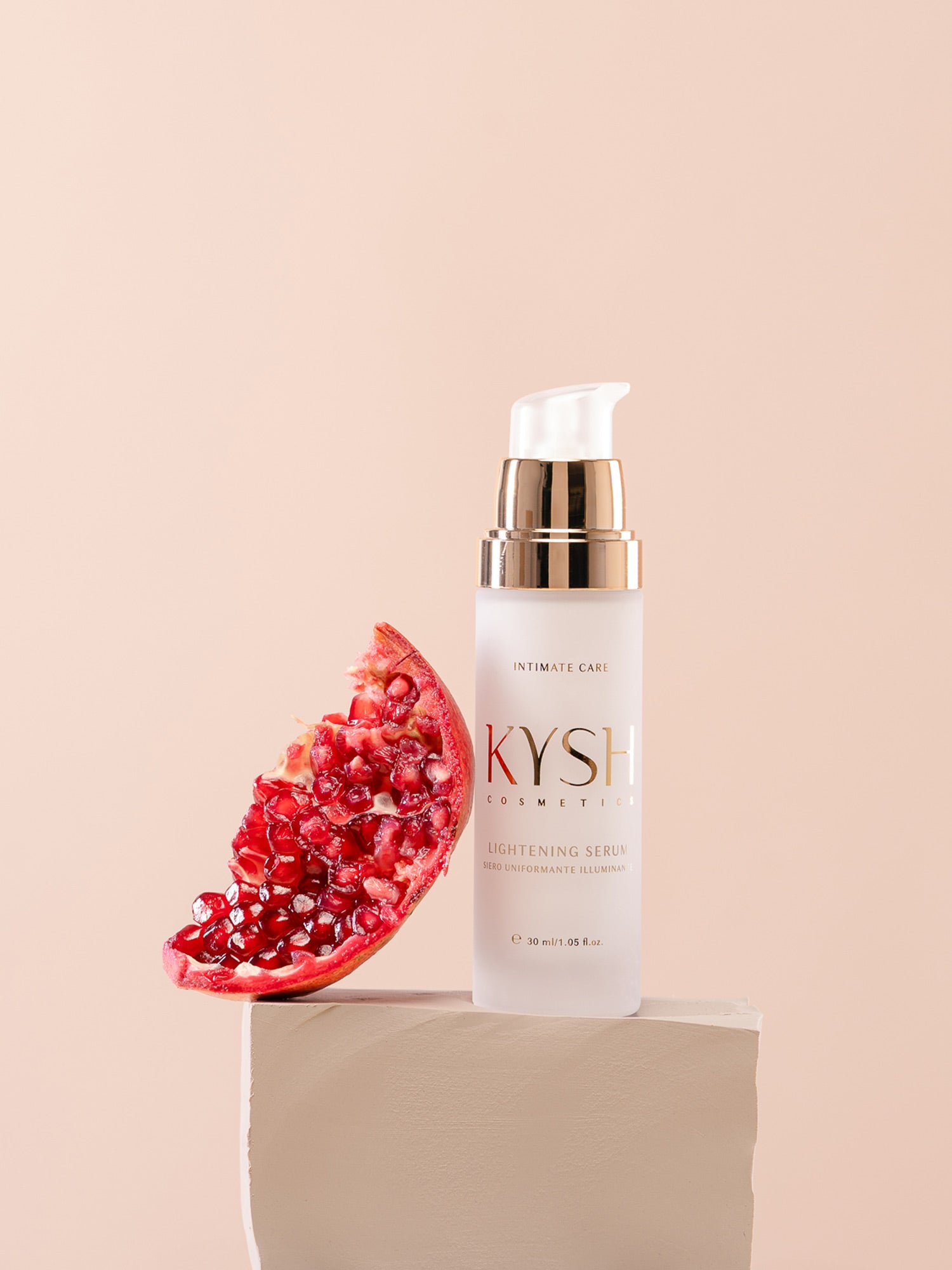 KYSH lightening serum bottle with a pomegranate on a beige background